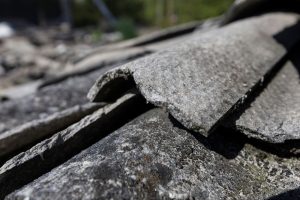 Concrete sheets with asbestos in them on a roof