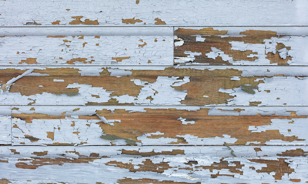 Cracking and peeling lead paint on wood siding